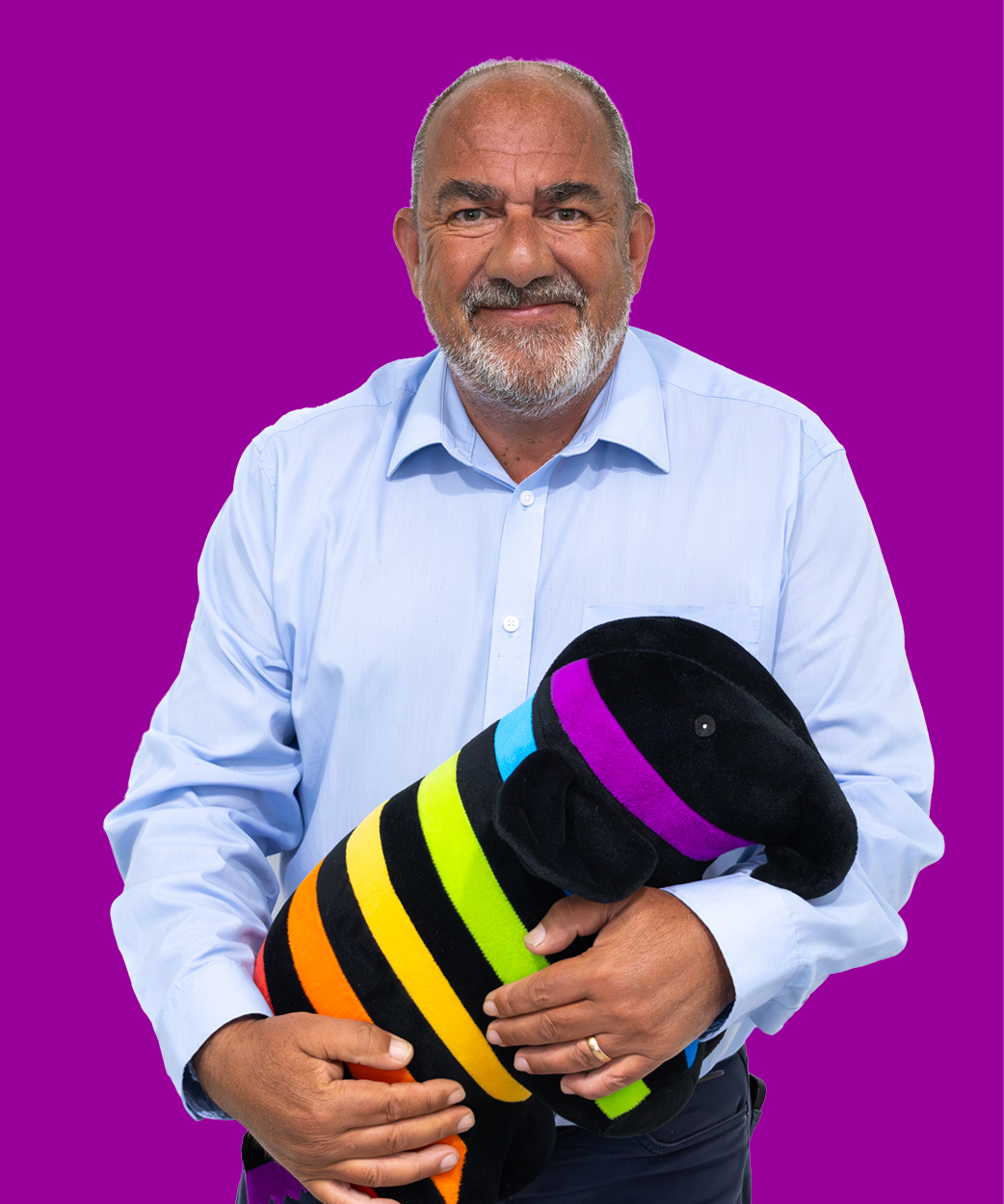 jim holding a caparol elephant on purple background