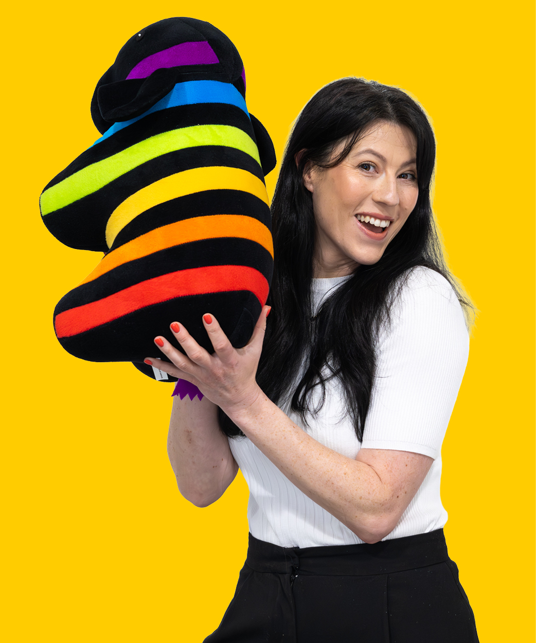 kylie holding a caparol elephant on a yellow background