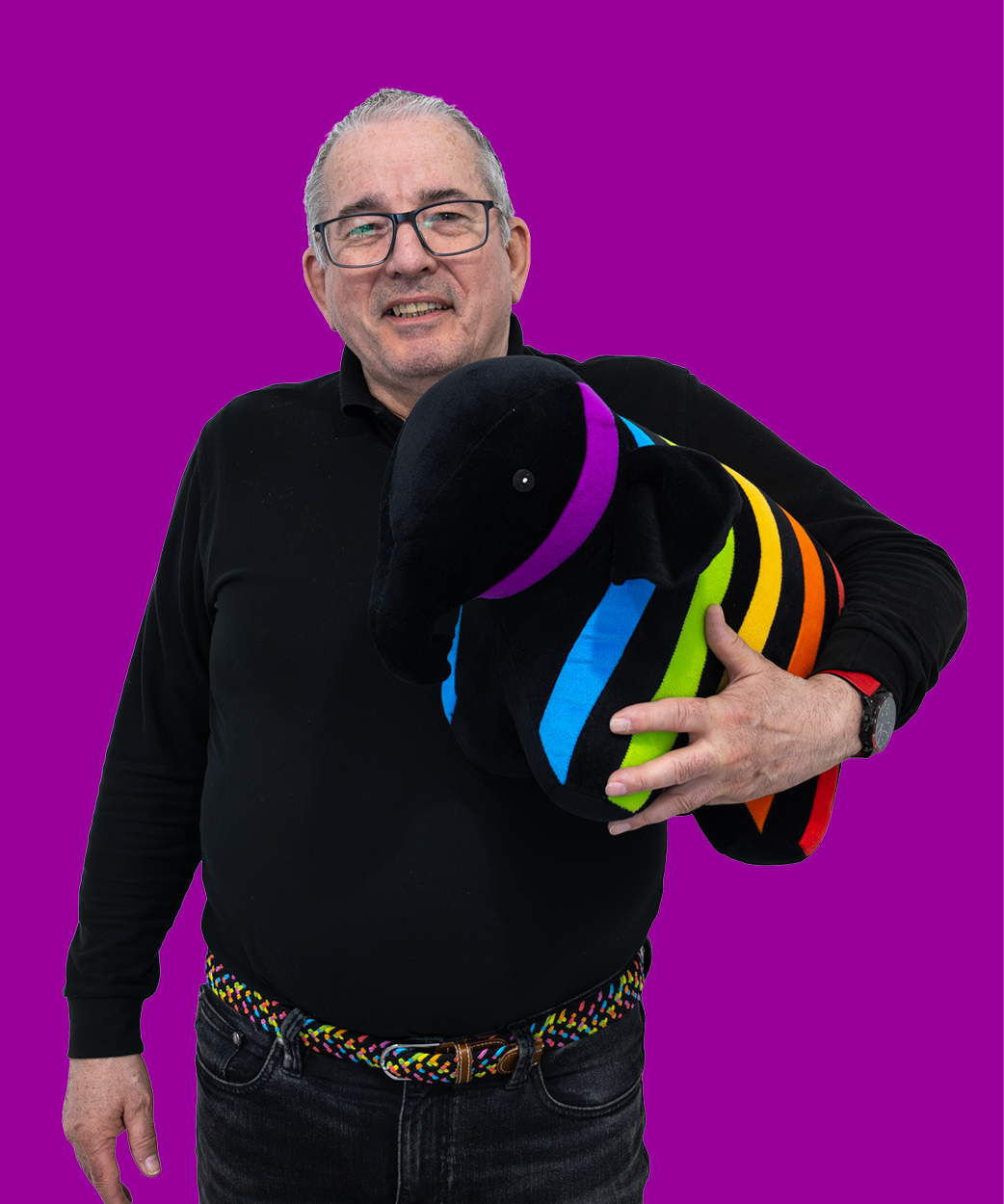martin holding a caparol elephant on a red background