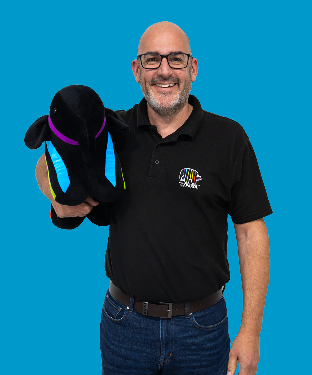 sam holding a caparol elephant on purple background